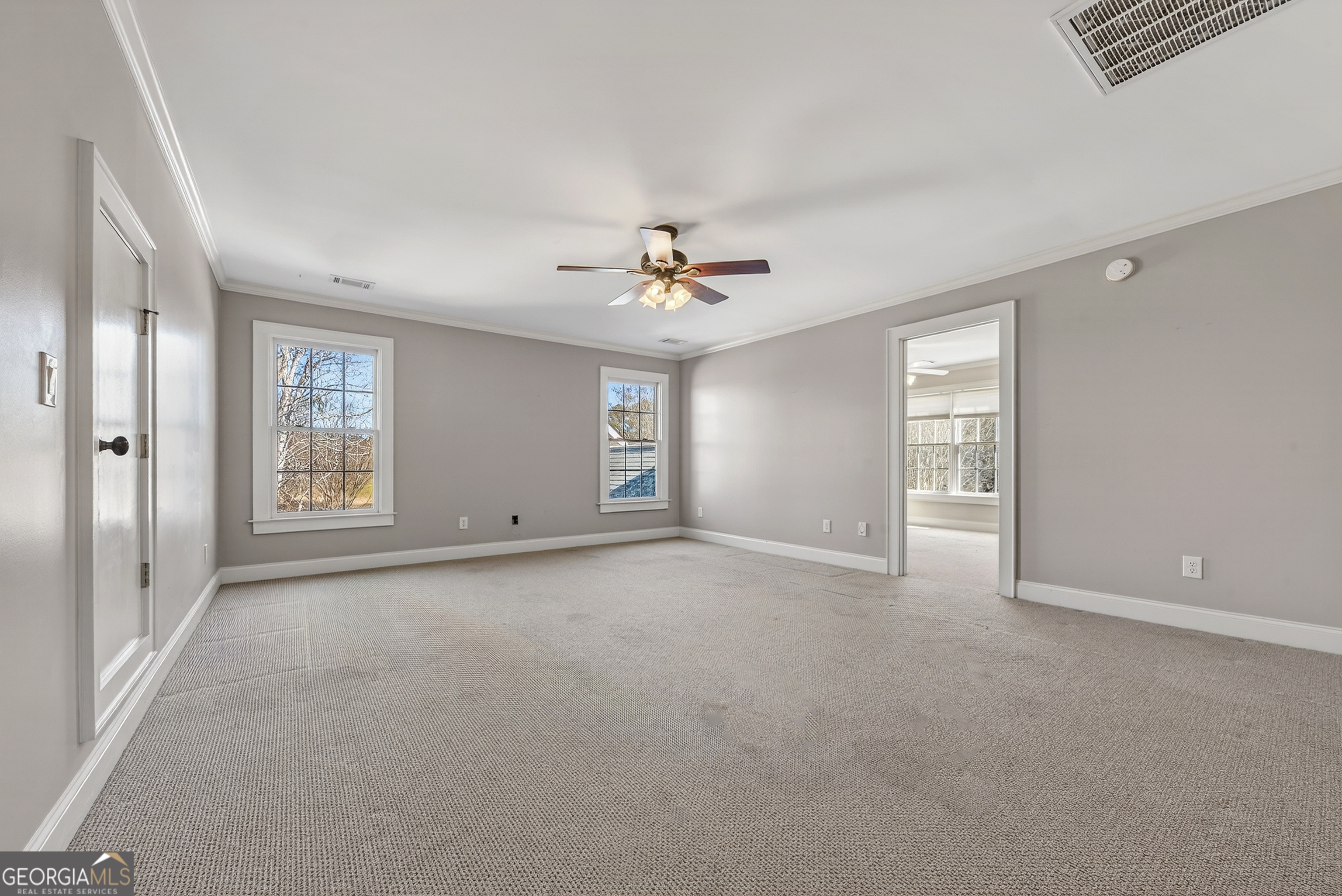 1000 Boxwood Place Madison, GA 30650 - Photo 46 of 75 a view of a room with a ceiling fan and window