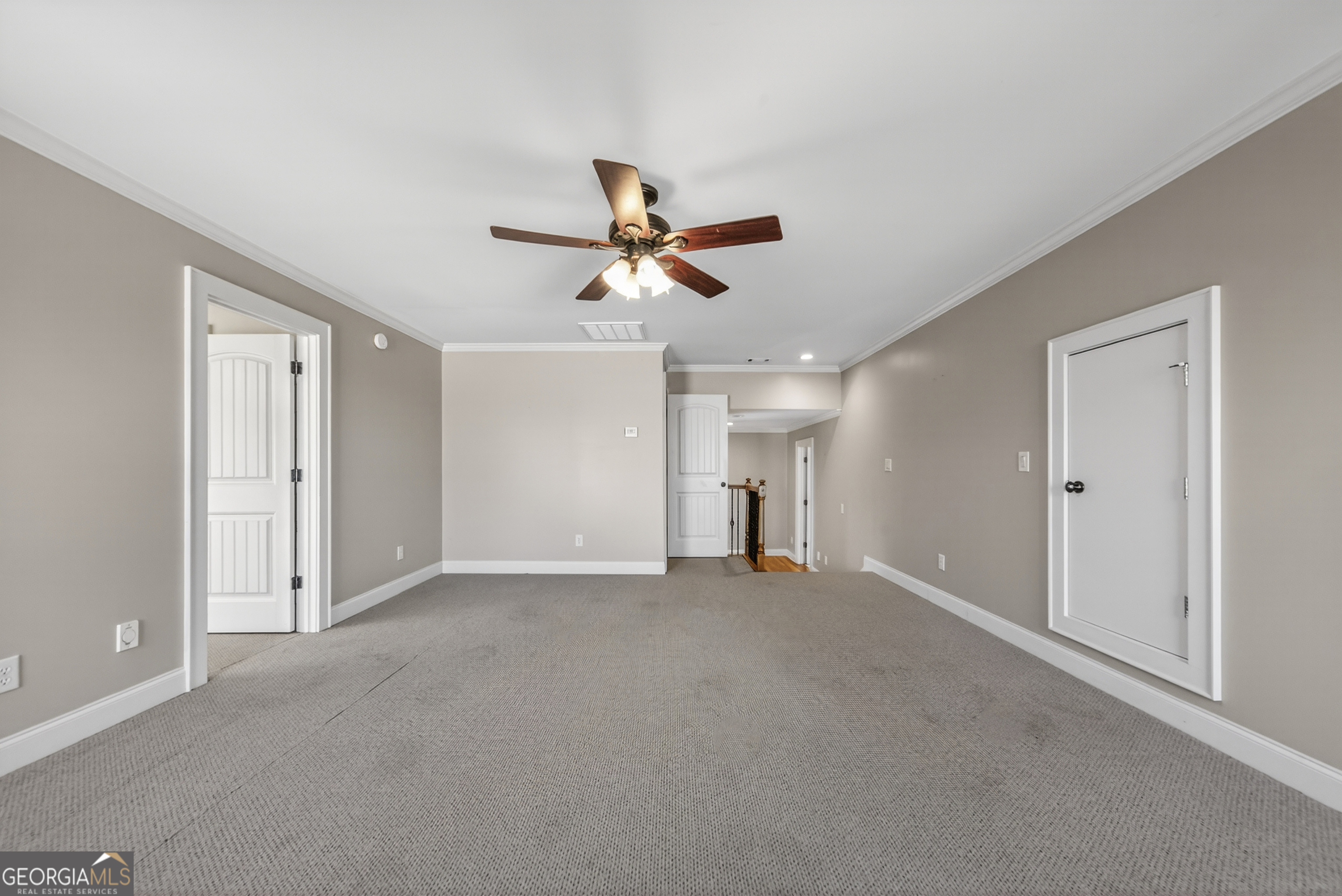 1000 Boxwood Place Madison, GA 30650 - Photo 55 of 75 an empty room with ceiling fan and window