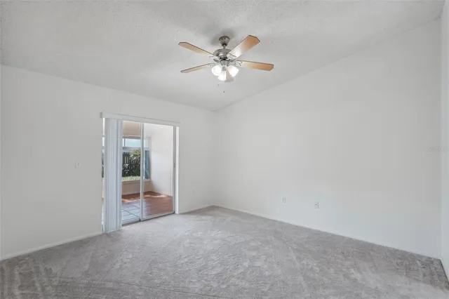 a view of an empty room with a fan