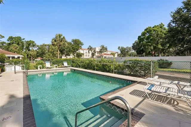 a view of a swimming pool with a patio