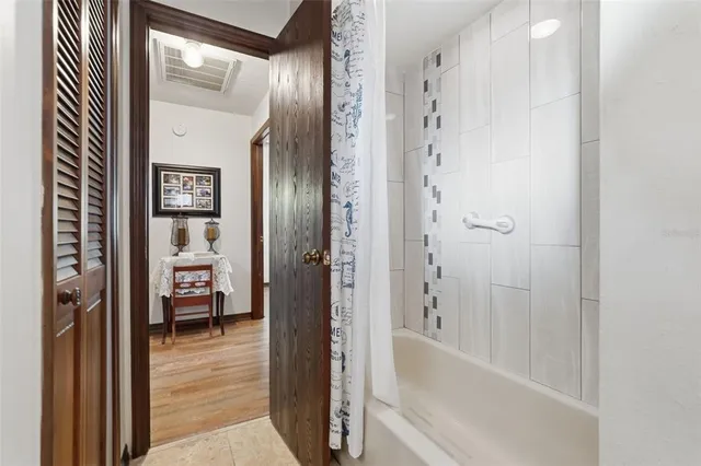 a bathroom with a bathtub and a shower