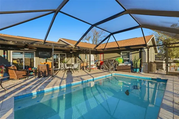 a view of a swimming pool with a patio