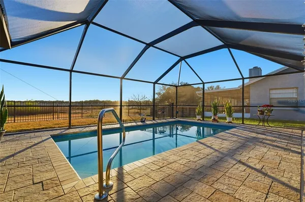 a view of a swimming pool with a porch