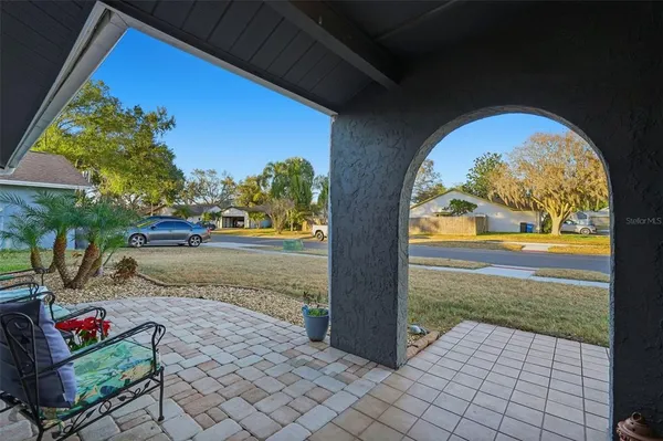 a view of yard with patio