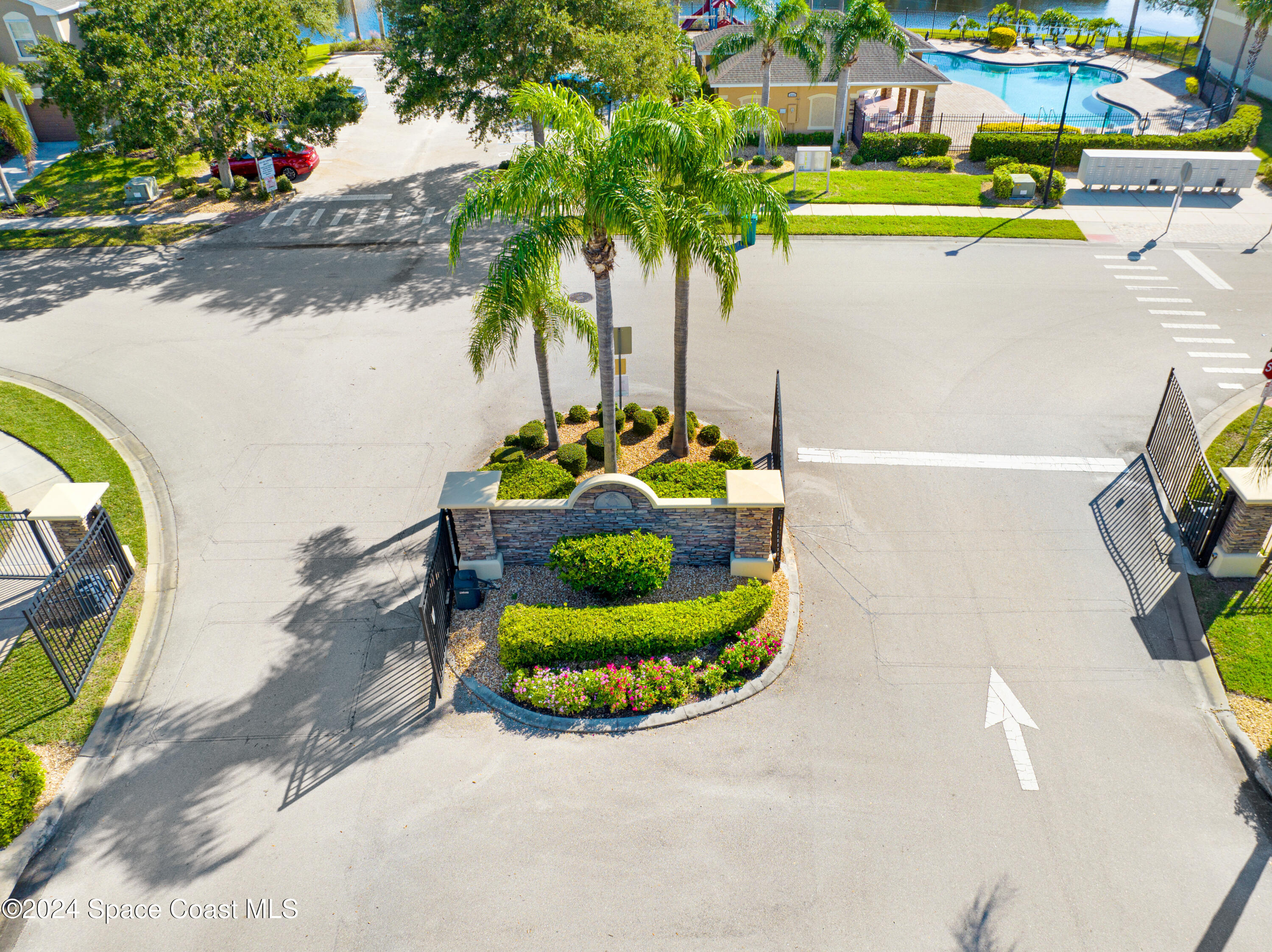 2785 Reston Street, Unit 103 Melbourne, FL 32935 - Photo 19 of 44 a view of a swimming pool with a yard and plants