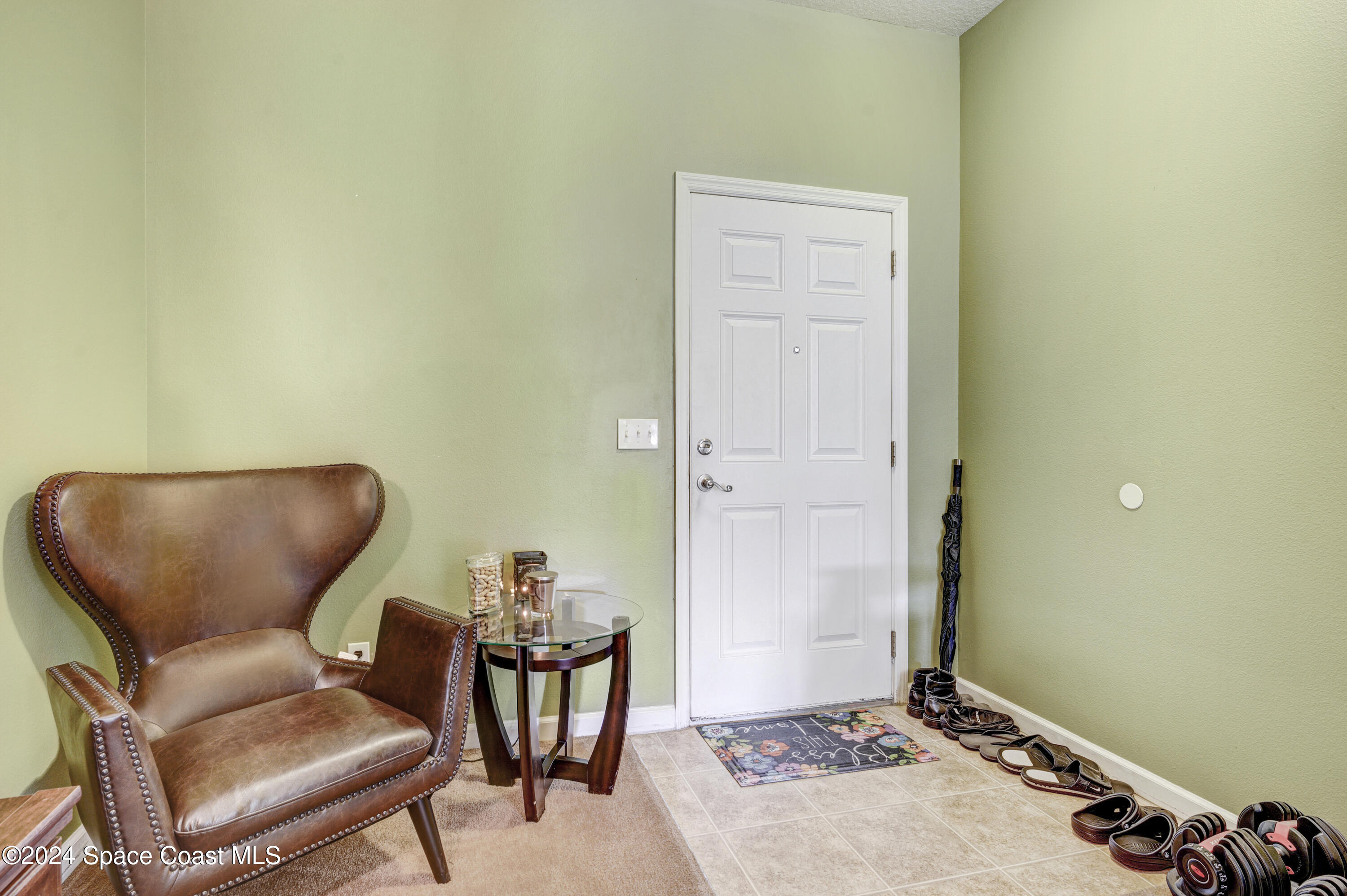 2785 Reston Street, Unit 103 Melbourne, FL 32935 - Photo 23 of 44 a living room with furniture