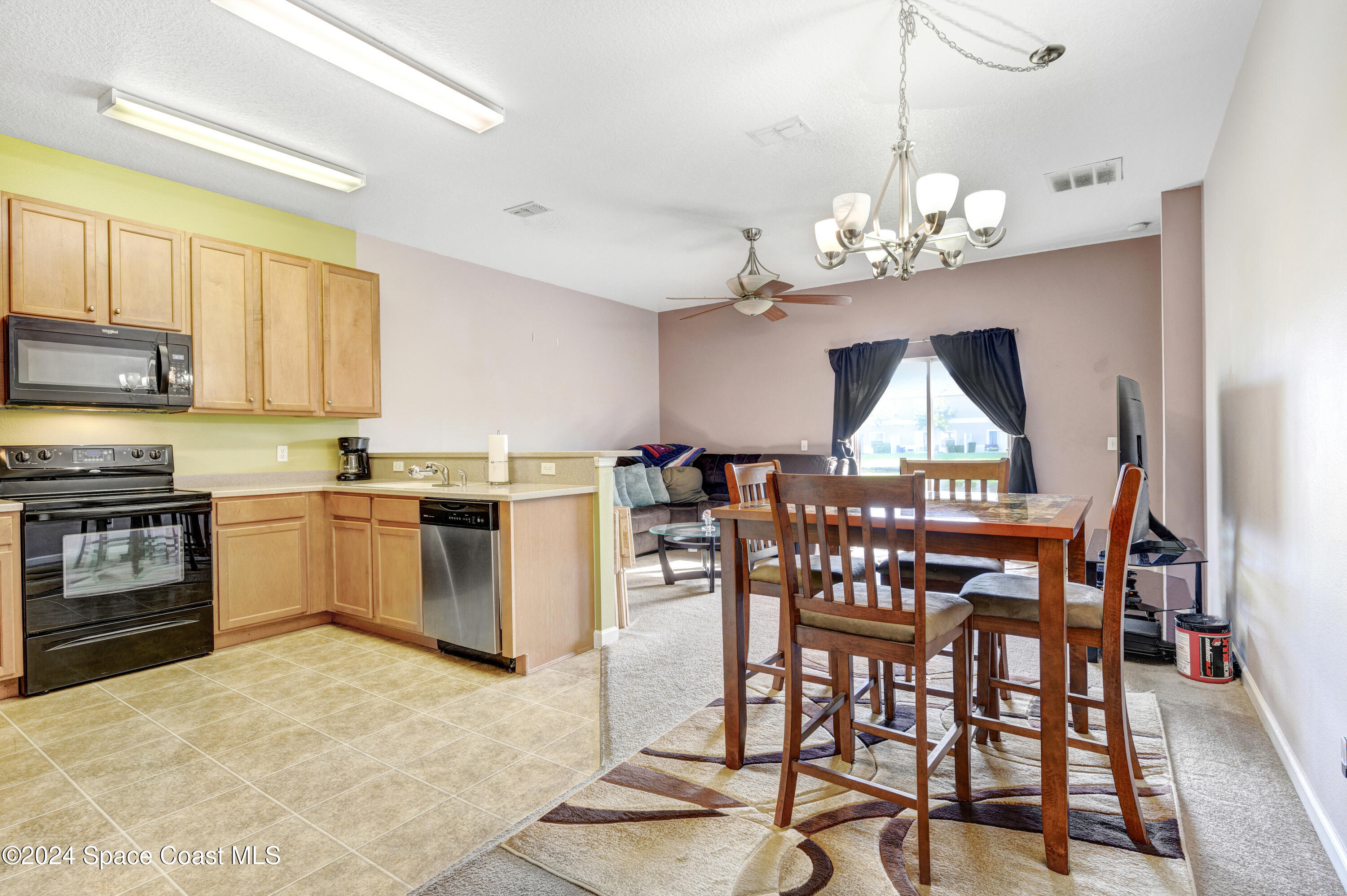 2785 Reston Street, Unit 103 Melbourne, FL 32935 - Photo 27 of 44 a view of a dining room kitchen and a window