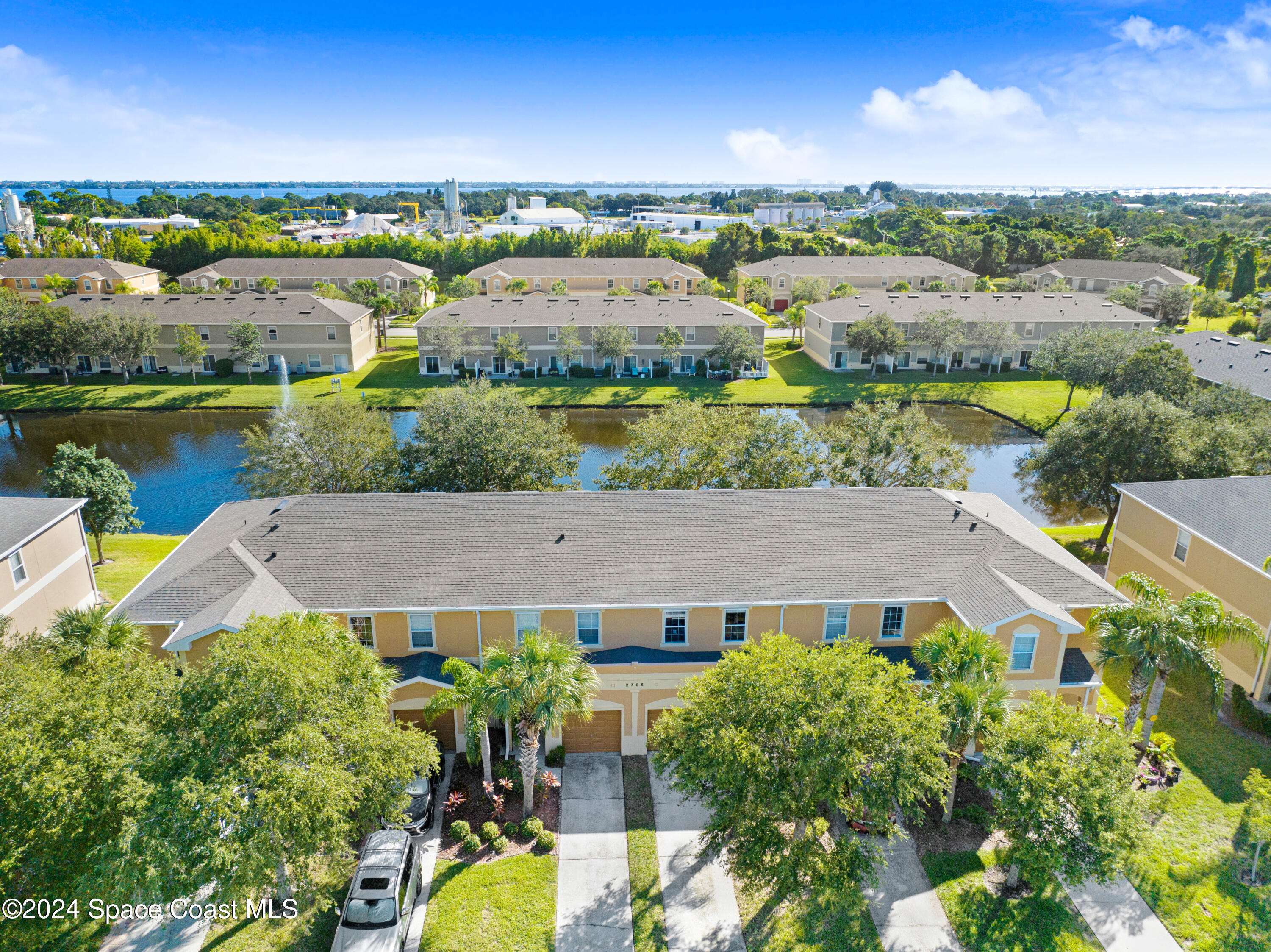 2785 Reston Street, Unit 103 Melbourne, FL 32935 - Photo 4 of 44 an aerial view of house with yard swimming pool and outdoor seating