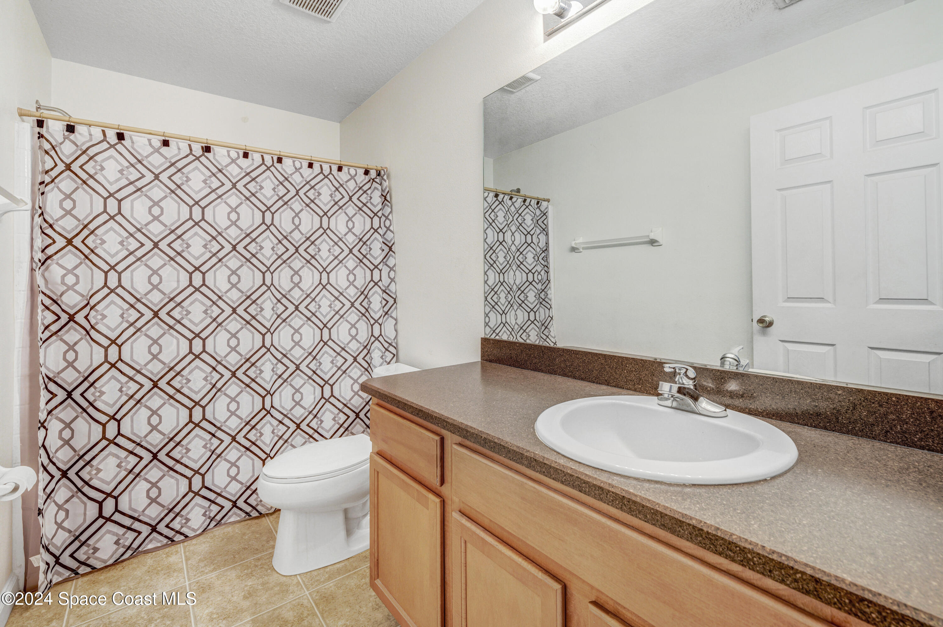 2785 Reston Street, Unit 103 Melbourne, FL 32935 - Photo 42 of 44 a bathroom with a sink and a toilet
