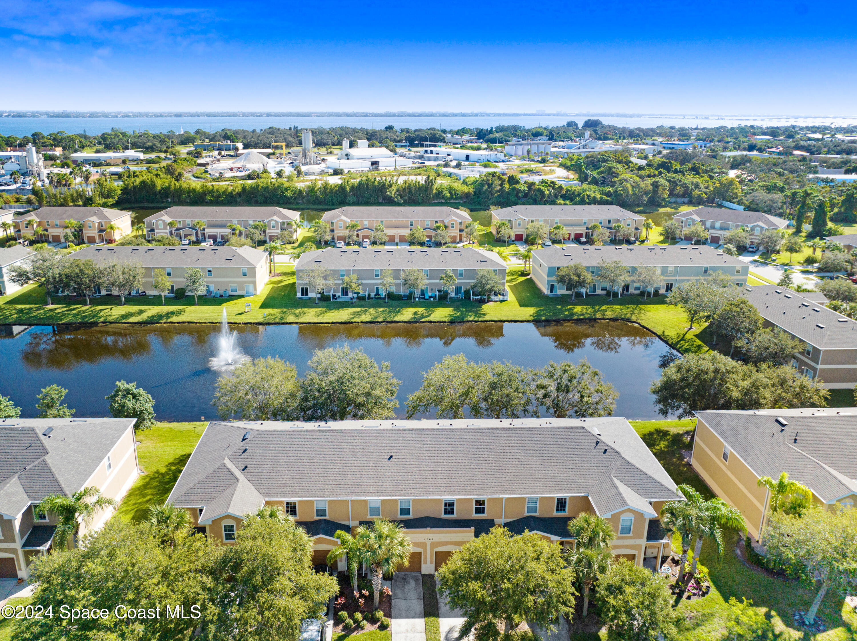 2785 Reston Street, Unit 103 Melbourne, FL 32935 - Photo 5 of 44 an aerial view of a city with lake view