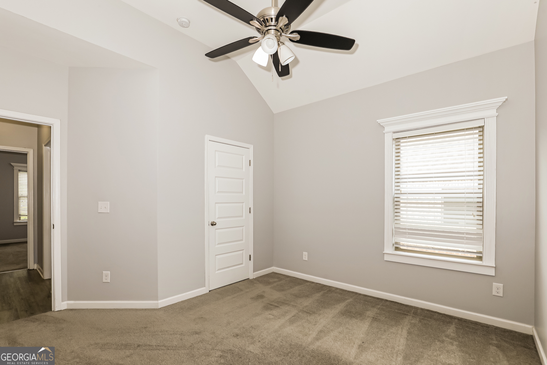 3216 Alhambra Circle Hampton, GA 30228 - Photo 18 of 21 an empty room with closet and windows