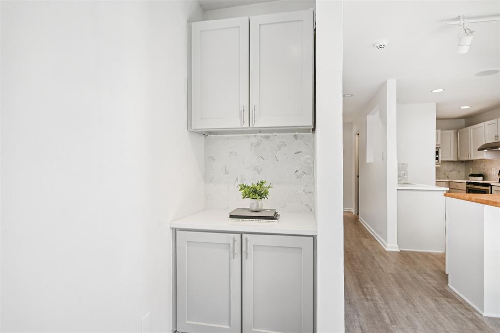 4102 Bowser Avenue, Unit 1 Dallas, TX 75219 - Photo 13 of 33 A built-in serving station with quartz counters and matching backsplash adds style and utility.