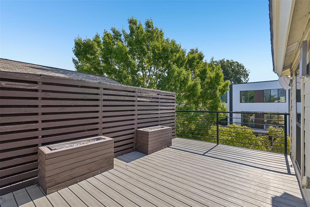 4102 Bowser Avenue, Unit 1 Dallas, TX 75219 - Photo 32 of 33 Expansive rooftop deck surrounded by treetop views creates an ideal setting for relaxing or entertaining.