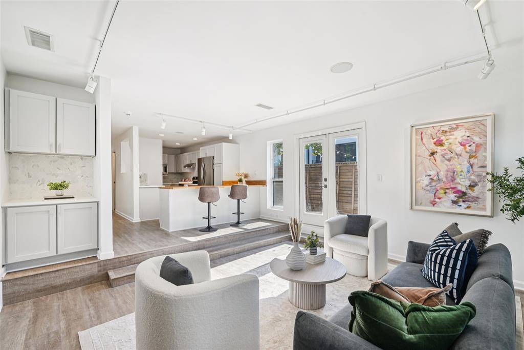 4102 Bowser Avenue, Unit 1 Dallas, TX 75219 - Photo 5 of 33 Step-up layout connects the living area to the reimagined kitchen, accentuating flow and openness.