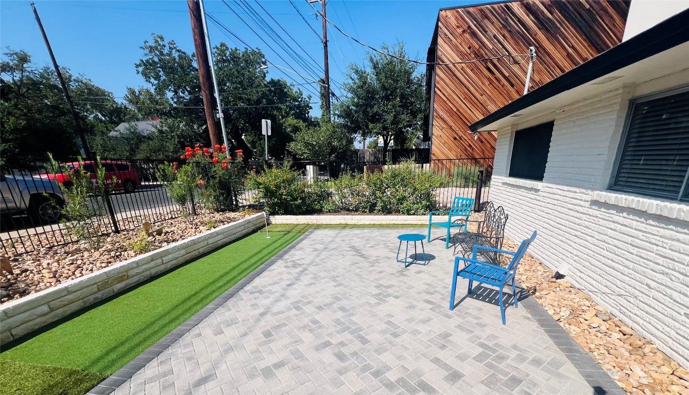 1715 Bluebonnet Lane, Unit A Austin, TX 78704 - Photo 2 of 13 a view of a chair and table in backyard of the house