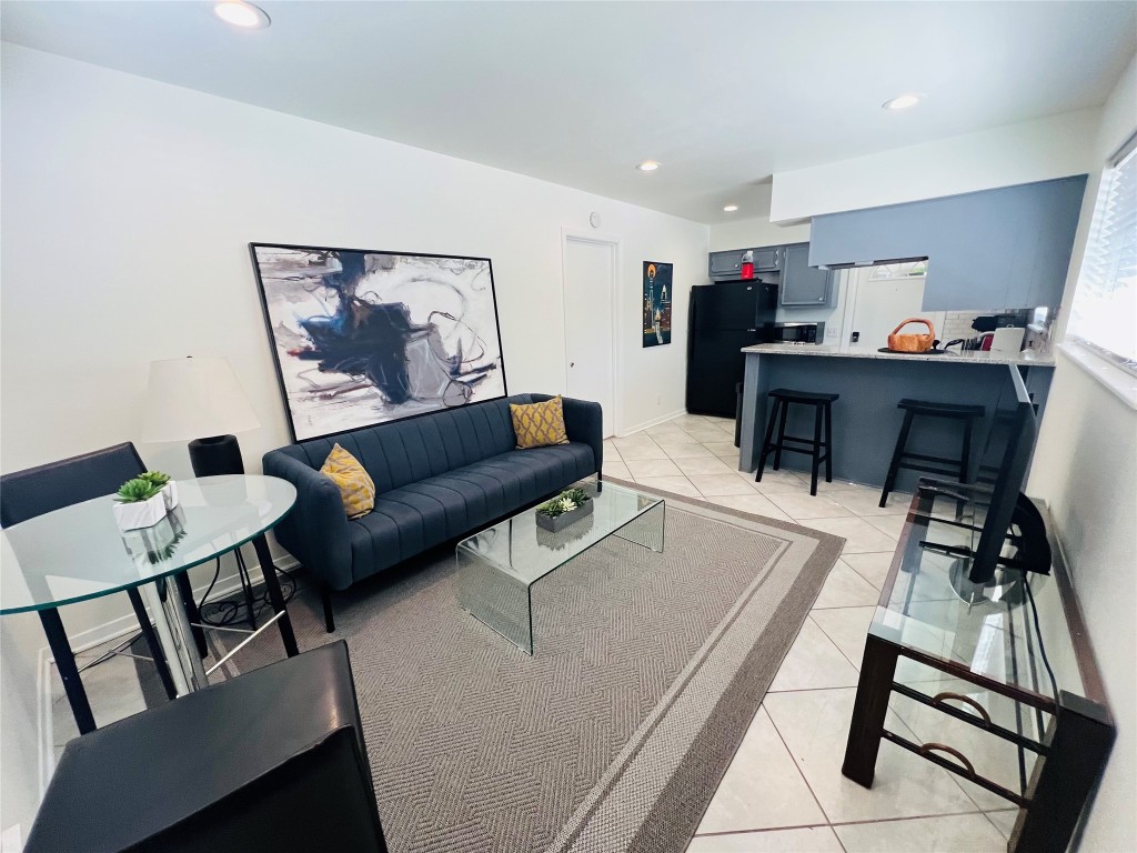 1715 Bluebonnet Lane, Unit A Austin, TX 78704 - Photo 3 of 13 a living room with furniture and a flat screen tv