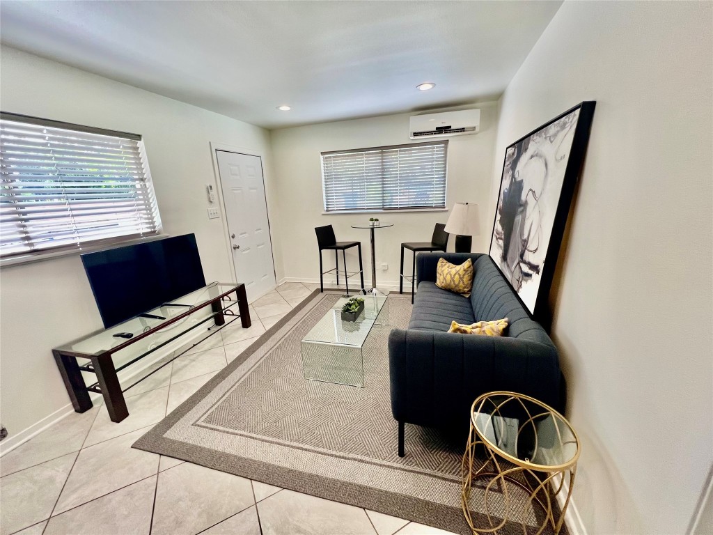 1715 Bluebonnet Lane, Unit A Austin, TX 78704 - Photo 4 of 13 a view of a workspace with furniture and a window