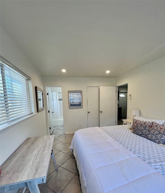 1715 Bluebonnet Lane, Unit A Austin, TX 78704 - Photo 7 of 13 a bedroom with a large bed and a window