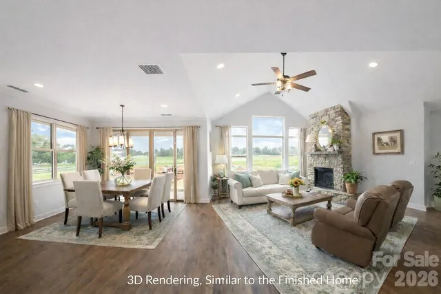 a dining room with furniture a chandelier and a rug