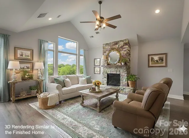 a living room with furniture a fireplace and a large mirror