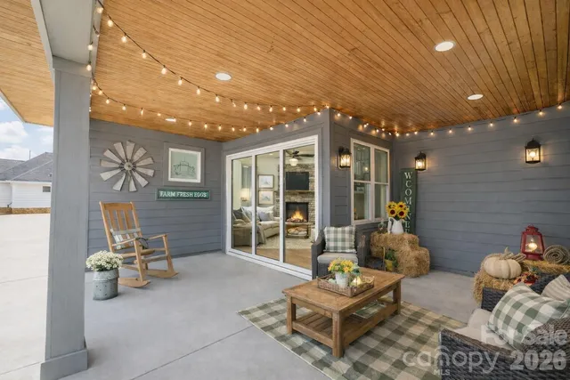 a outdoor living space with furniture and large window