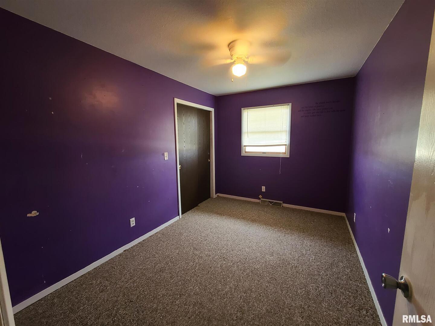 1564 East 300 N Road Cowden, IL 62422 - Photo 26 of 50 an empty room with windows and chandelier fan