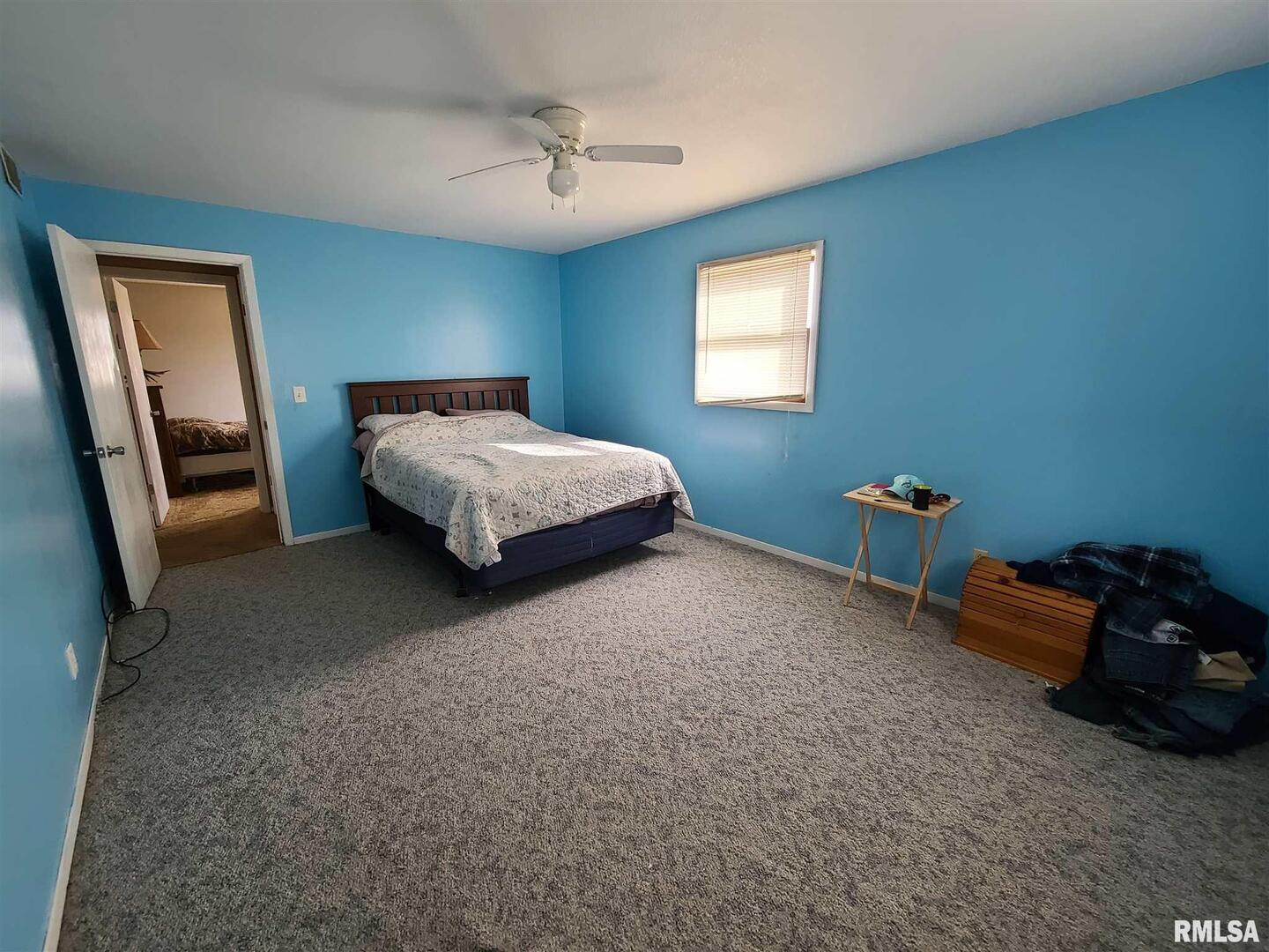 1564 East 300 N Road Cowden, IL 62422 - Photo 27 of 50 a bedroom with a bed window and a couch
