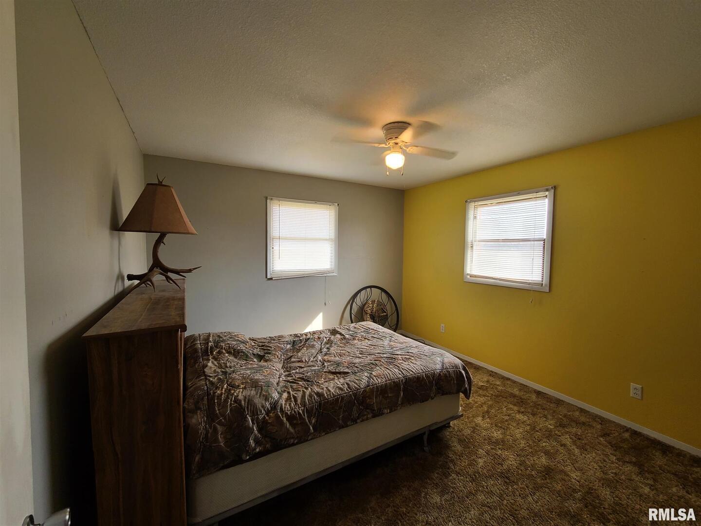 1564 East 300 N Road Cowden, IL 62422 - Photo 29 of 50 a bedroom with a bed and a window