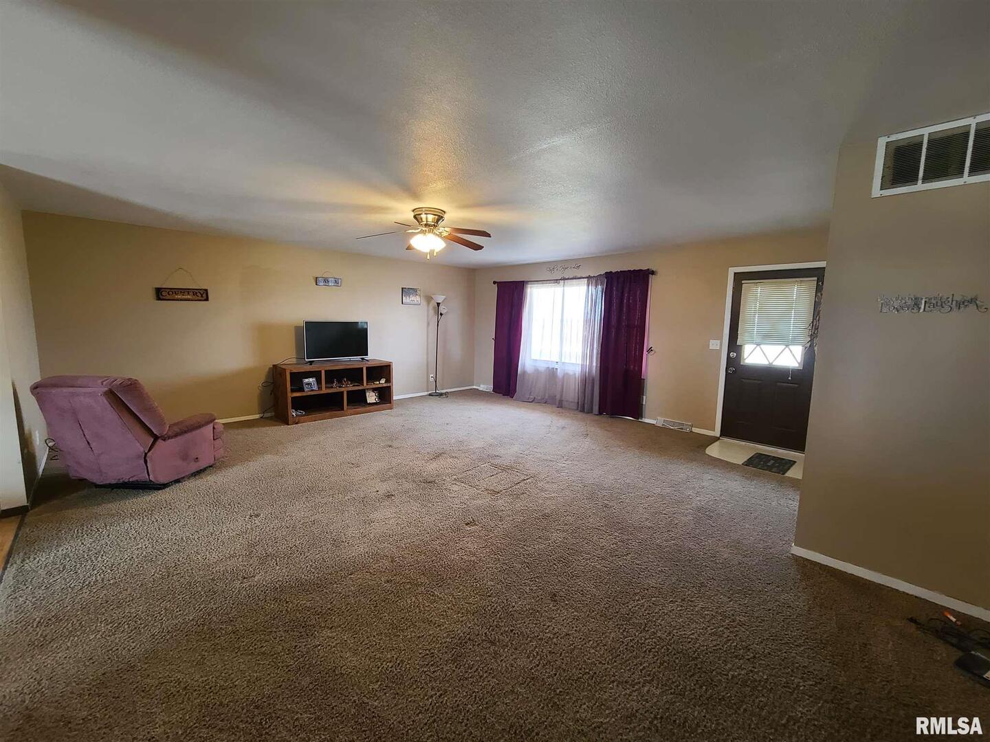 1564 East 300 N Road Cowden, IL 62422 - Photo 36 of 50 a living room with furniture and a chandelier