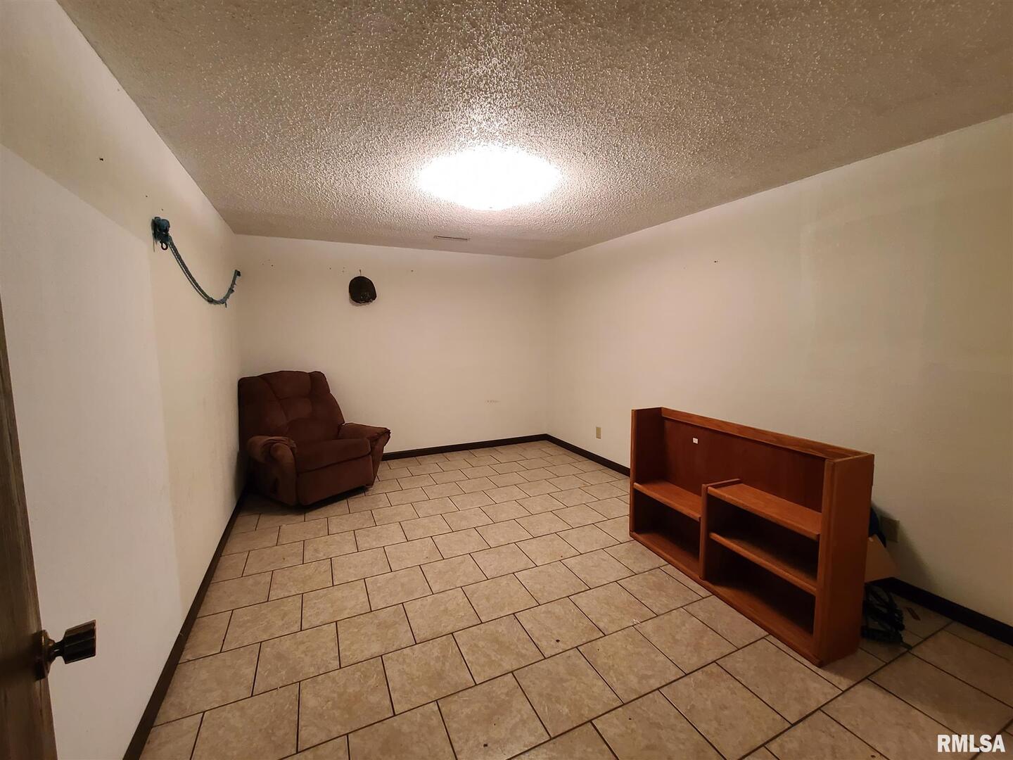 1564 East 300 N Road Cowden, IL 62422 - Photo 48 of 50 a bedroom with a bed and a dresser in it