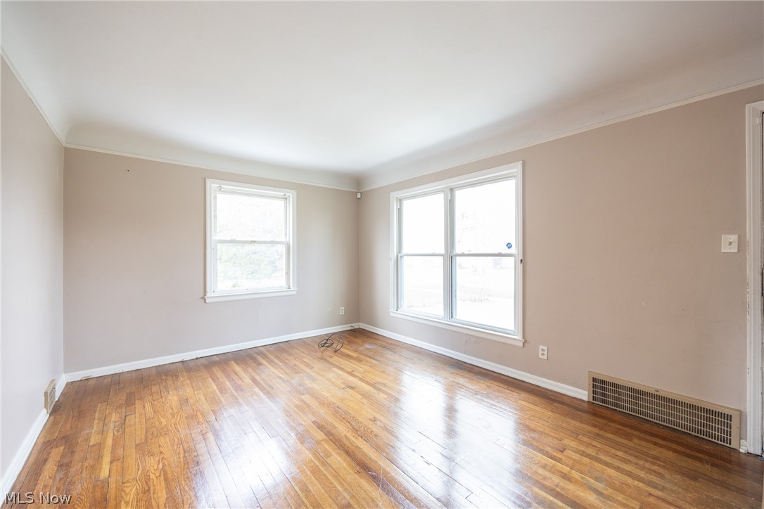 4344 West Anderson Road South Euclid, OH 44121 - Photo 5 of 14 Unfurnished room with ornamental molding and light hardwood / wood-style flooring