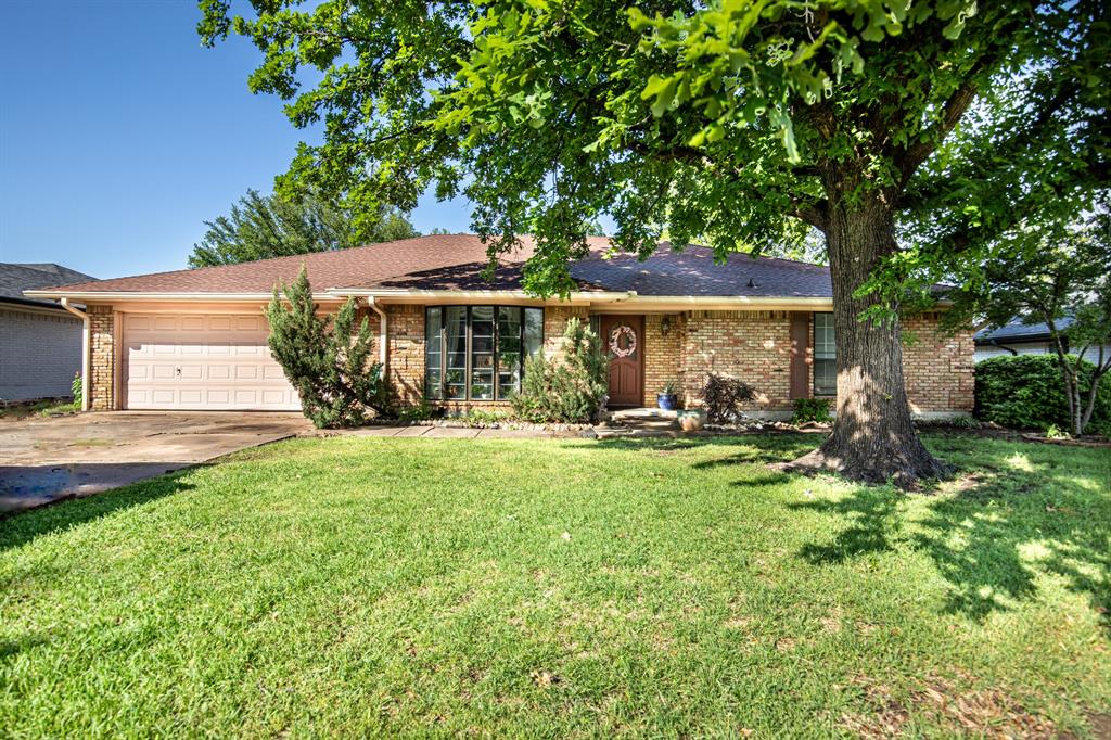 4100 Alava Drive Fort Worth, TX 76133 - Photo 1 of 1 a front view of a house with yard and green space