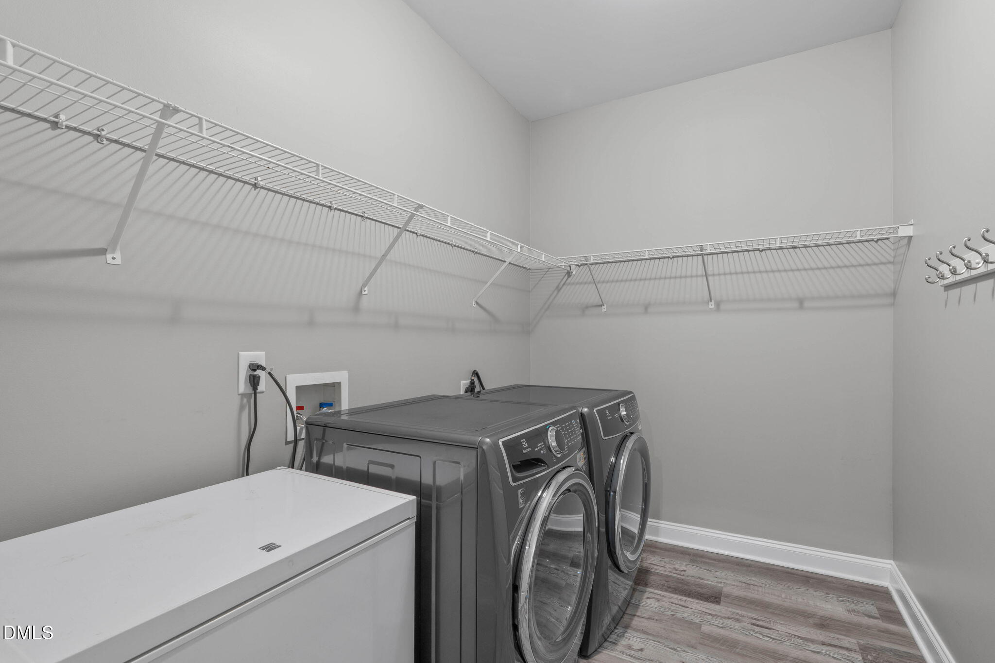 2450 Rolling Tracks Road Willow Spring, NC 27592 - Photo 26 of 64 a utility room with dryer and washer