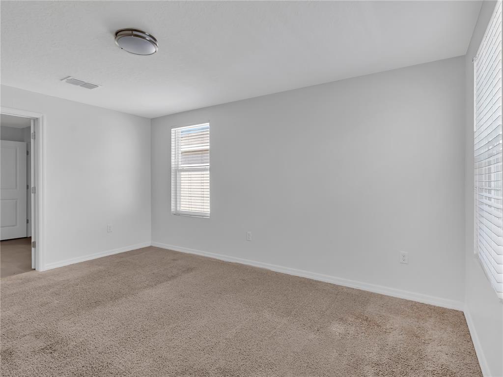 602 Olive Conch Street Ruskin, FL 33570 - Photo 11 of 23 an empty room with a window