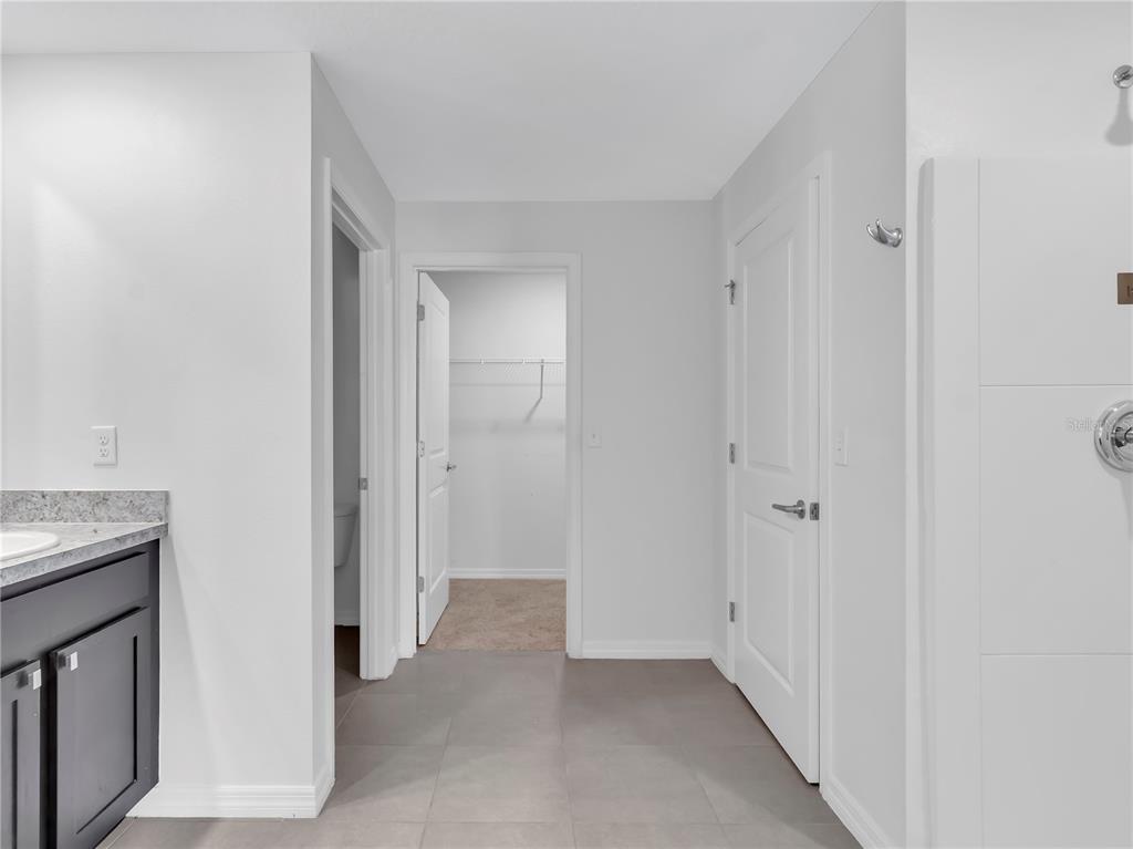 602 Olive Conch Street Ruskin, FL 33570 - Photo 12 of 23 a view of a hallway with closet