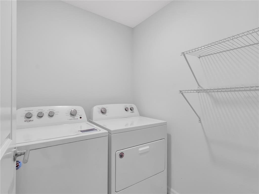 602 Olive Conch Street Ruskin, FL 33570 - Photo 15 of 23 a utility room with dryer and washer