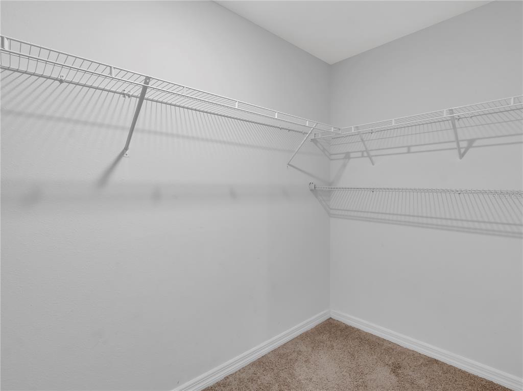 602 Olive Conch Street Ruskin, FL 33570 - Photo 16 of 23 a view of a room with racks on the wall