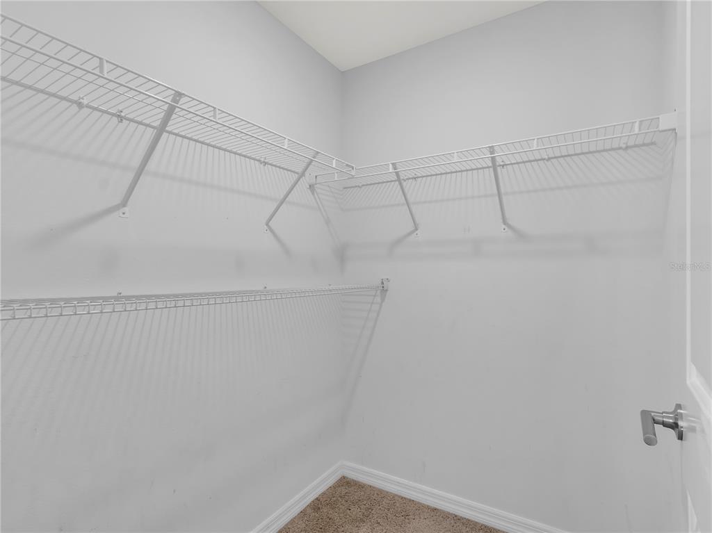 602 Olive Conch Street Ruskin, FL 33570 - Photo 17 of 23 a view of a room with racks on the wall