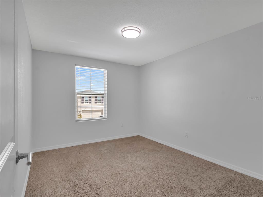 602 Olive Conch Street Ruskin, FL 33570 - Photo 19 of 23 an empty room with a window