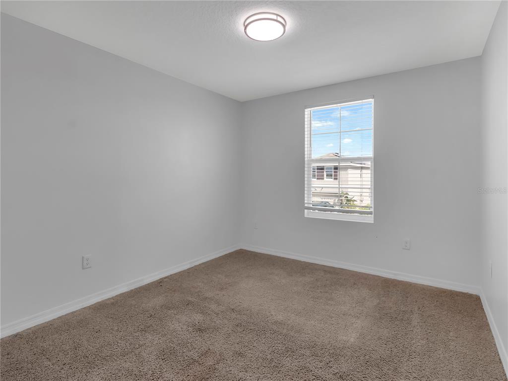 602 Olive Conch Street Ruskin, FL 33570 - Photo 20 of 23 an empty room with windows