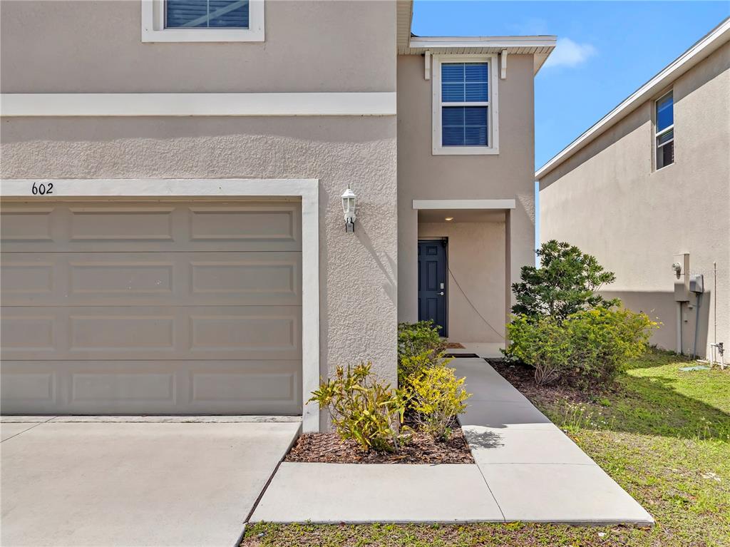 602 Olive Conch Street Ruskin, FL 33570 - Photo 2 of 23 a view of a entryway door front of house