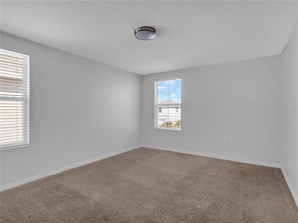 602 Olive Conch Street Ruskin, FL 33570 - Photo 21 of 23 a view of an empty room with a window