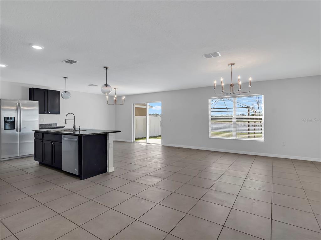 602 Olive Conch Street Ruskin, FL 33570 - Photo 3 of 23 a view of kitchen with windows