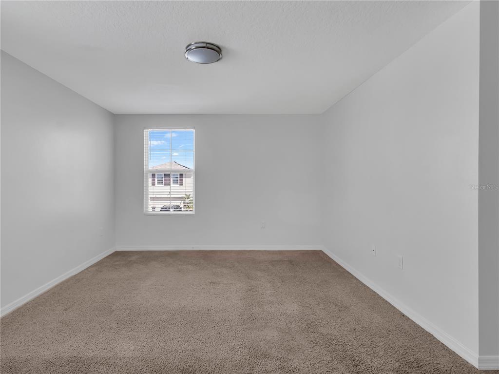 602 Olive Conch Street Ruskin, FL 33570 - Photo 10 of 23 an empty room with a window