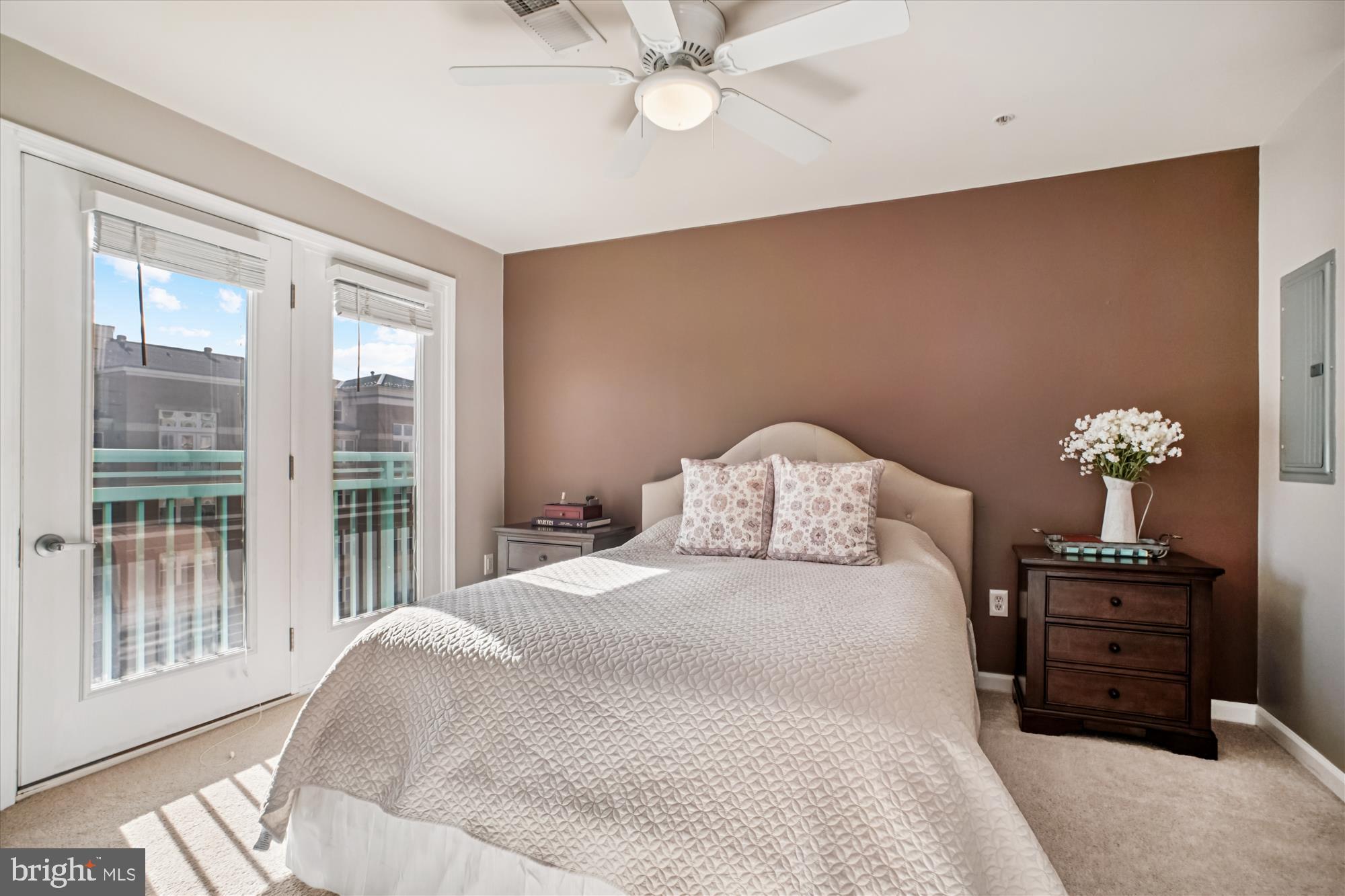 12000 Market Street, Unit 415 Reston, VA 20190 - Photo 12 of 34 a bedroom with a bed and a chandelier