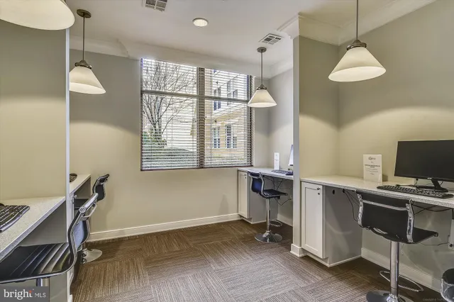 a kitchen with a dining table and chairs