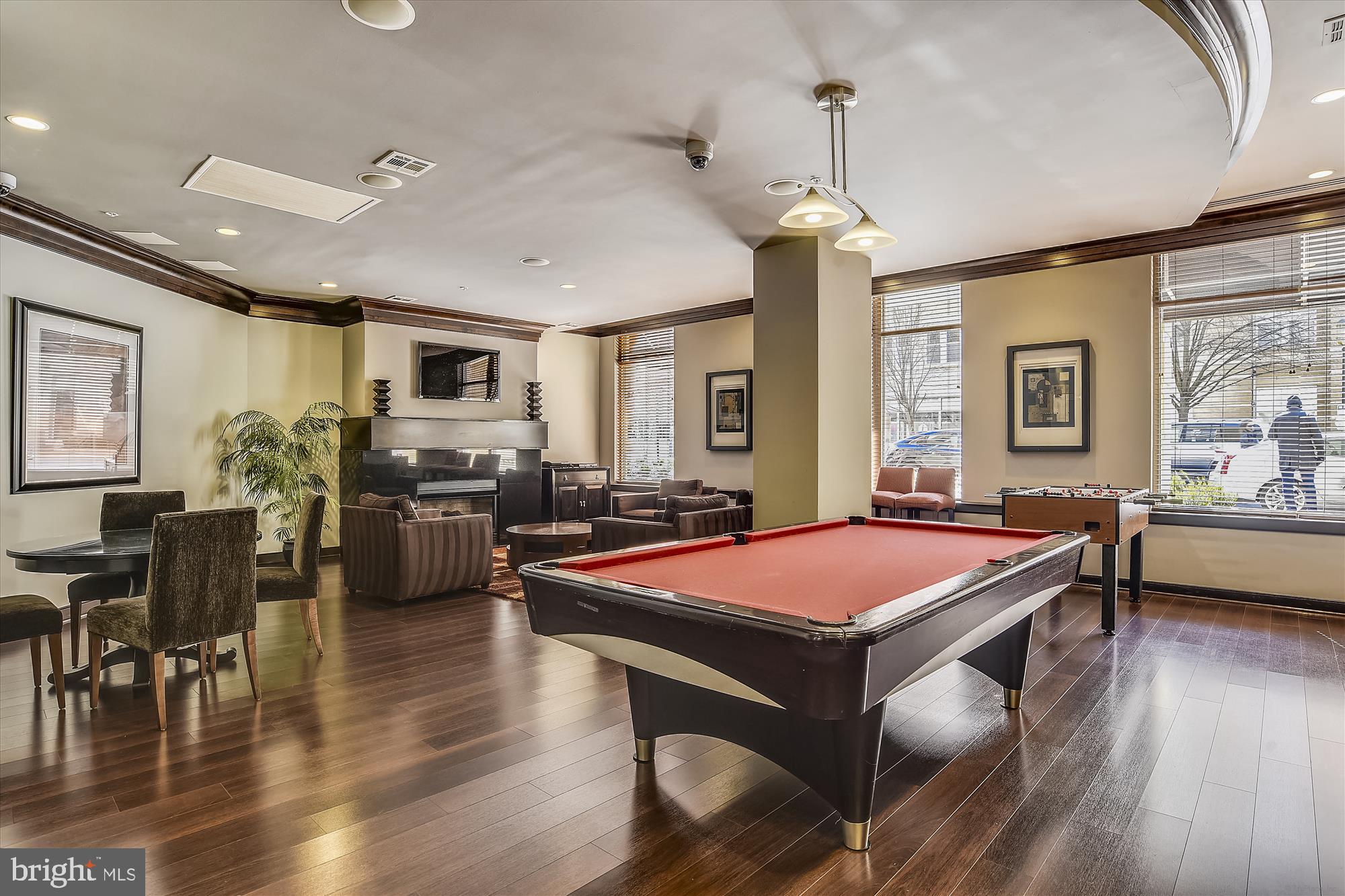 12000 Market Street, Unit 415 Reston, VA 20190 - Photo 33 of 34 a table and chairs in a room with kitchen view