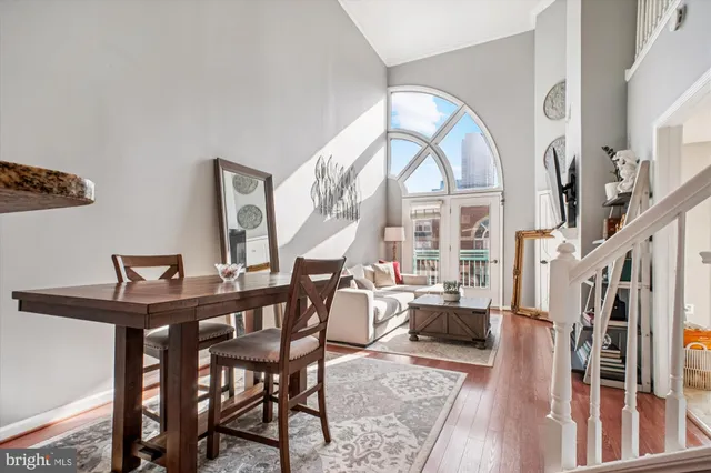 a view of hall way with furniture and a window