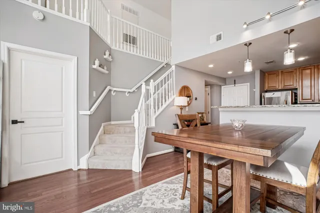 a room with lots of furniture and wooden floor