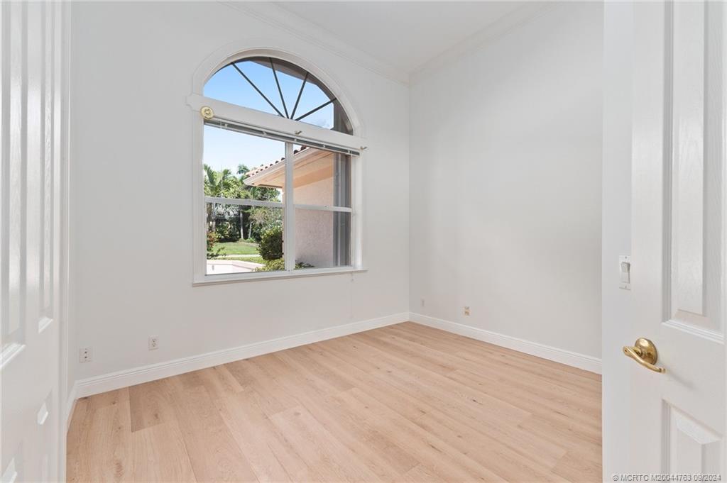 60 North River Road Stuart, FL 34996 - Photo 20 of 74 a view of empty room with window and wooden floor